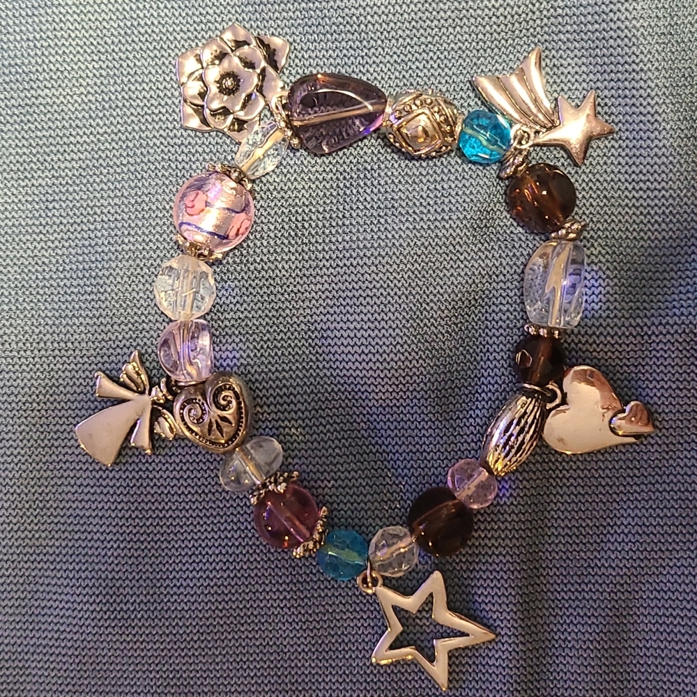 Stretchy beaded bracelet with silver charms